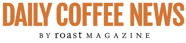 The image features the text "DAILY COFFEE NEWS" in bold, orange letters against a bright yellow background. Below it, the phrase "by Roast Magazine" is written in a smaller, black font. The overall design is vibrant and eye-catching, conveying a lively and engaging theme related to coffee news.