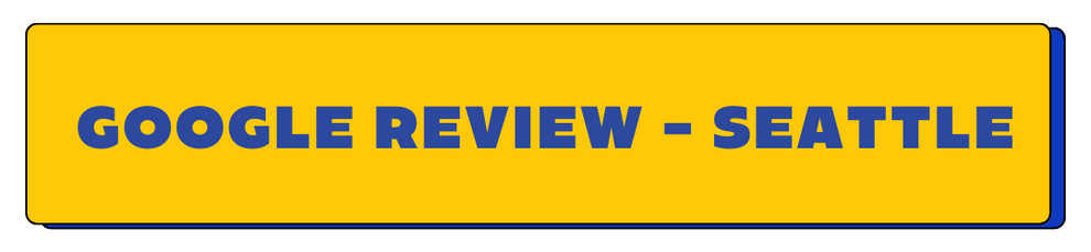 Yellow rectangular sign with 'GOOGLE REVIEW - SEATTLE' text in blue