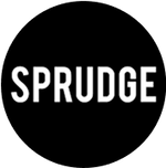 The image features the word "SPRUNGE" in bold, white letters against a solid black circular background. The design is simple and modern, emphasizing the text with a clean aesthetic. The overall look conveys a strong and impactful brand presence.