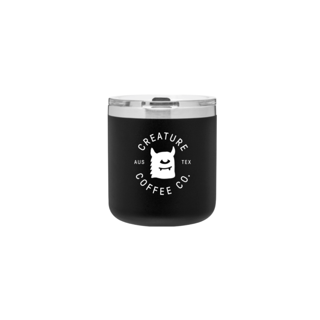 A cool travel tumbler for Creature Coffee, a camp mug designed by a local Austin artist